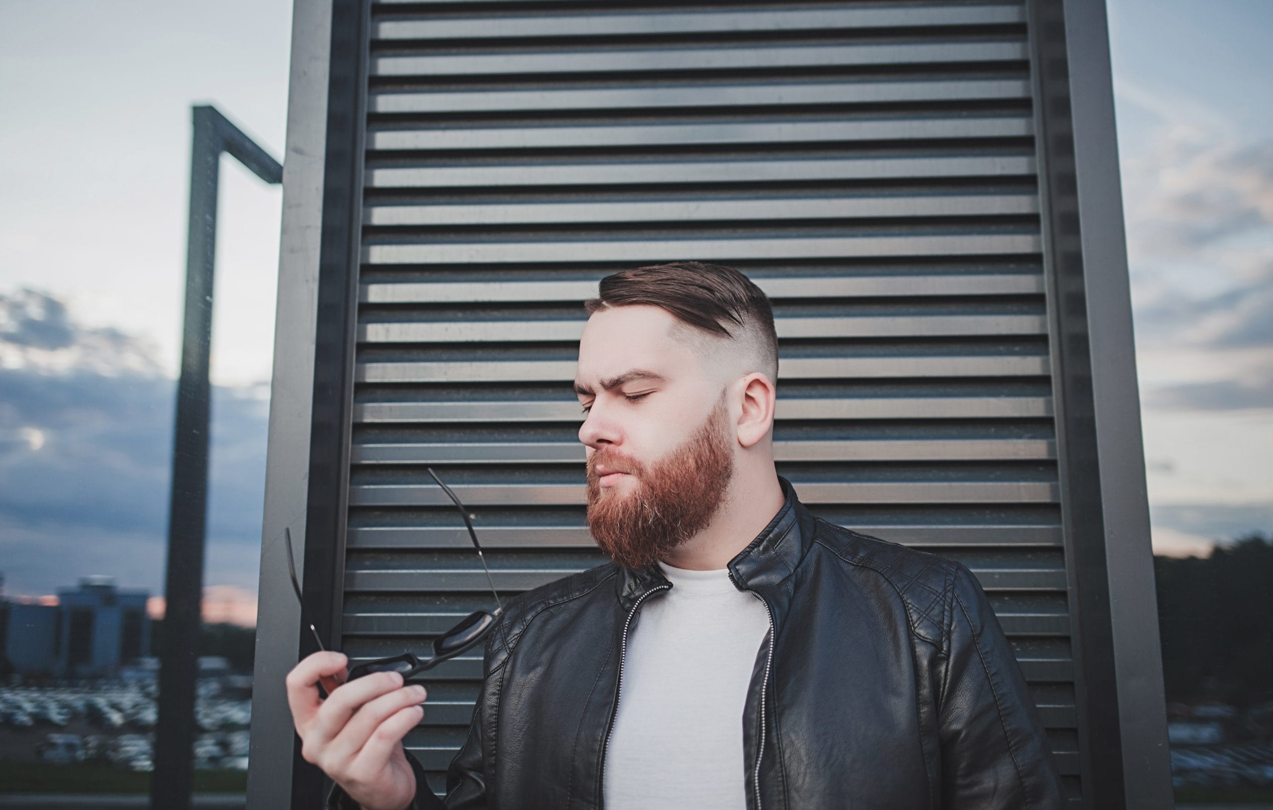 Latest Tips About Low Taper Fade with Beard 1 low taper fade with beard A man with a clean low taper fade haircut, perfectly blended into a well-trimmed beard.