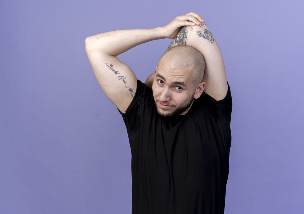 6 Buzz Cut Styles To Know Before Shave Your Head 2 A man with a clean and classic buzz cut, showcasing a short, uniform hairstyle that highlights his facial features. The look is sharp, modern, and low-maintenance.