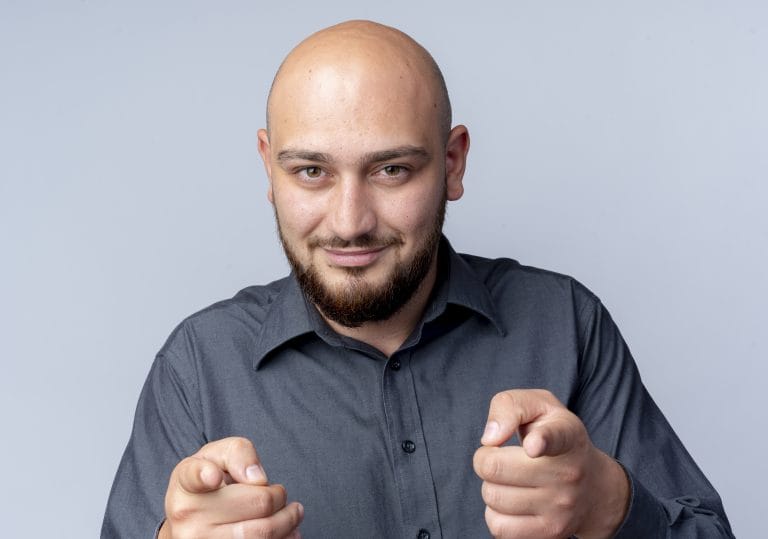 6 Buzz Cut Styles To Know Before Shave Your Head 8 A stylish man with a clean and classic buzz cut, showcasing a short, uniform hairstyle that highlights his facial features. The look is sharp, modern, and effortlessly cool.