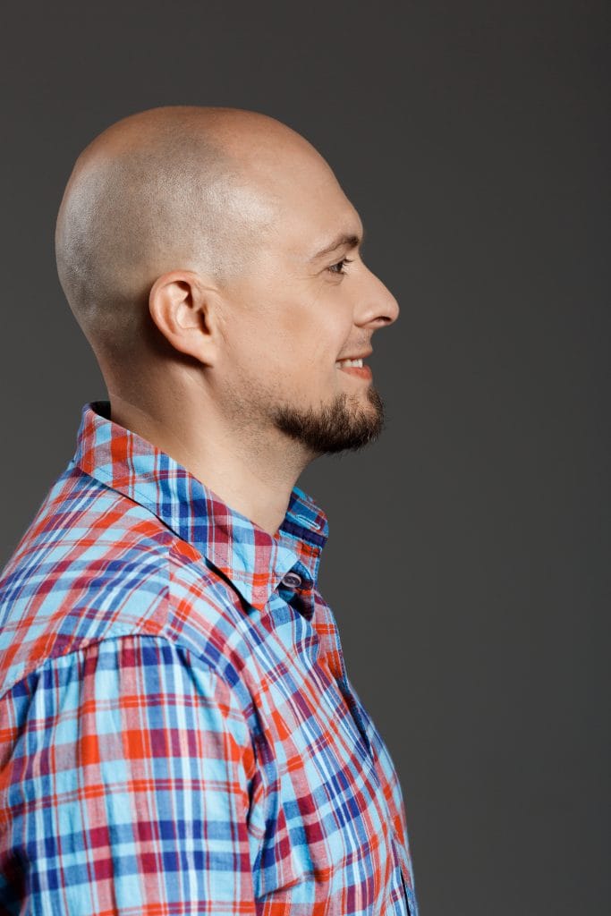 6 Buzz Cut Styles To Know Before Shave Your Head 4 A man with a sharp and clean buzz cut, showcasing a short, uniform hairstyle that exudes confidence and simplicity. The look is modern, versatile, and perfect for any occasion.
