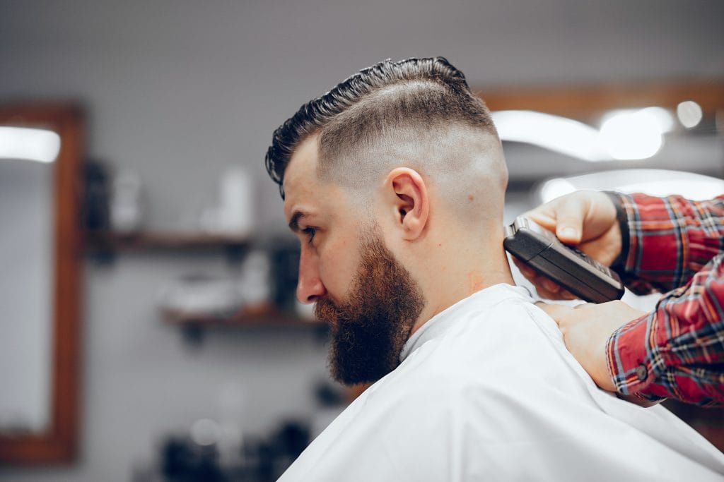 40 Perfect Low Taper Fade Haircuts For Men 8 A sharp low taper high fade haircut, featuring a gradual taper at the sides and back that transitions into a high fade, creating a bold contrast between the very short sides and the longer hair on top.